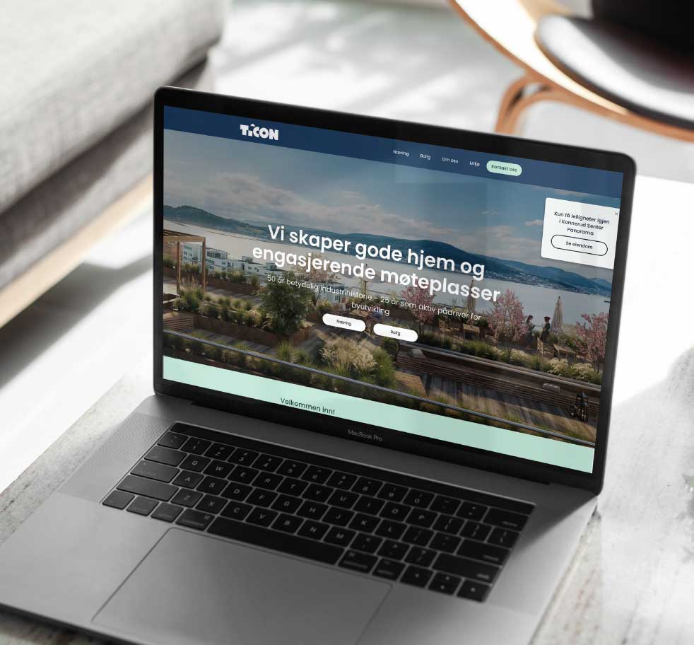 Bilde av en laptop med en nettside som viser selskapsside for et eiendomsselskap